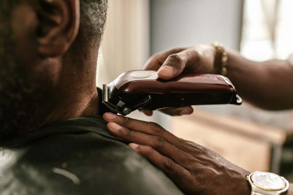 Person Holding Brown and Black Razor